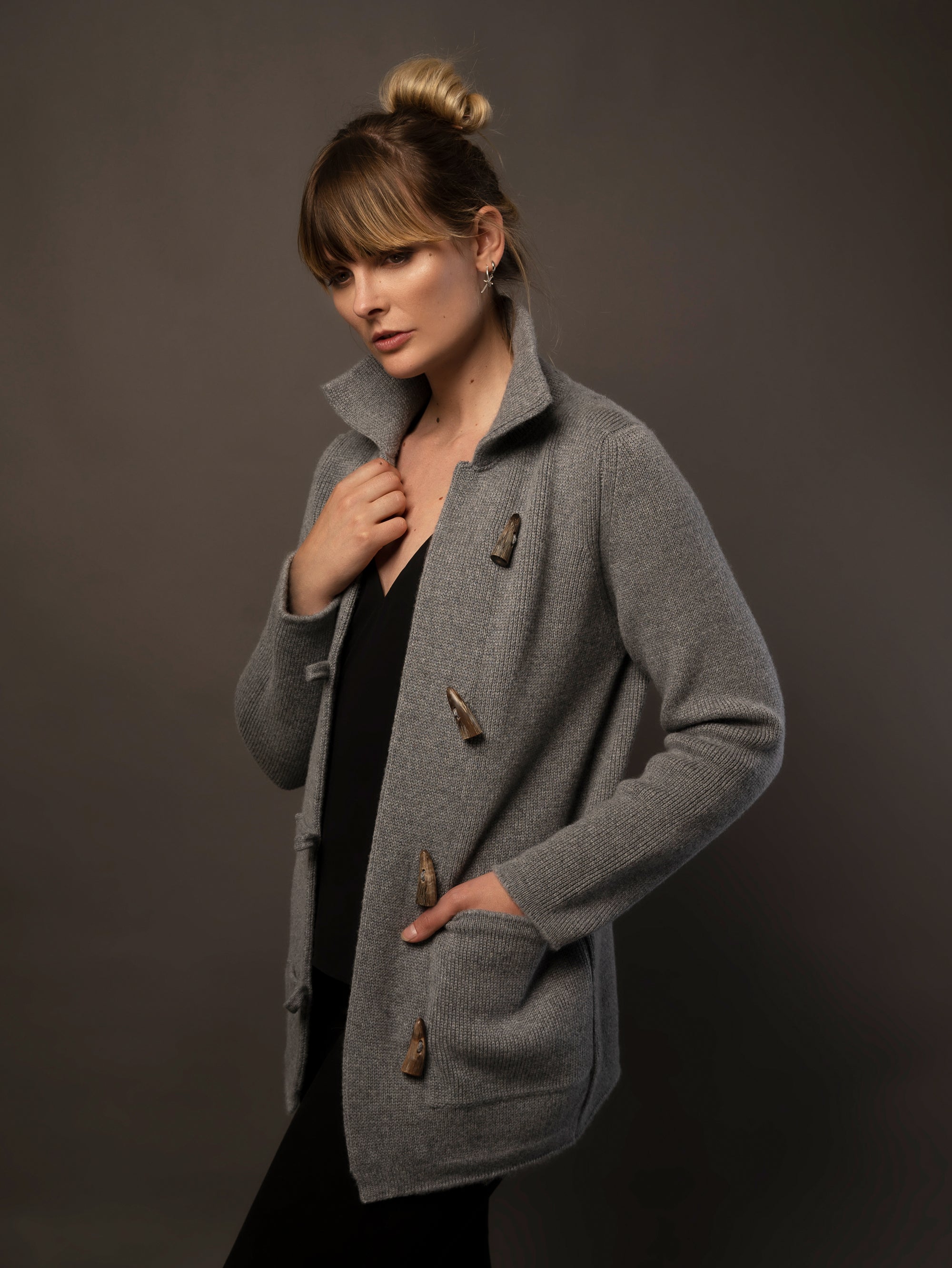 Ladies Cashmere Duffle Coat in Dark Grey. 100% cashmere handmade under the Royal Warrant in the UK. This is Cashmere at it's finest. 