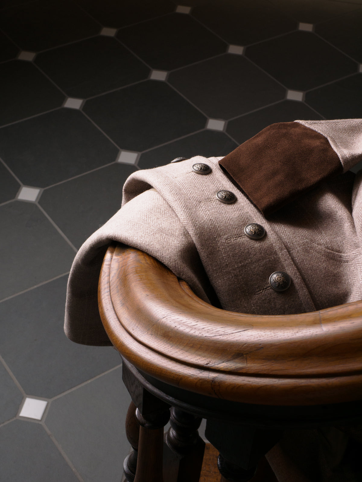 grey tweed and suede coat in a military style. made in the uk