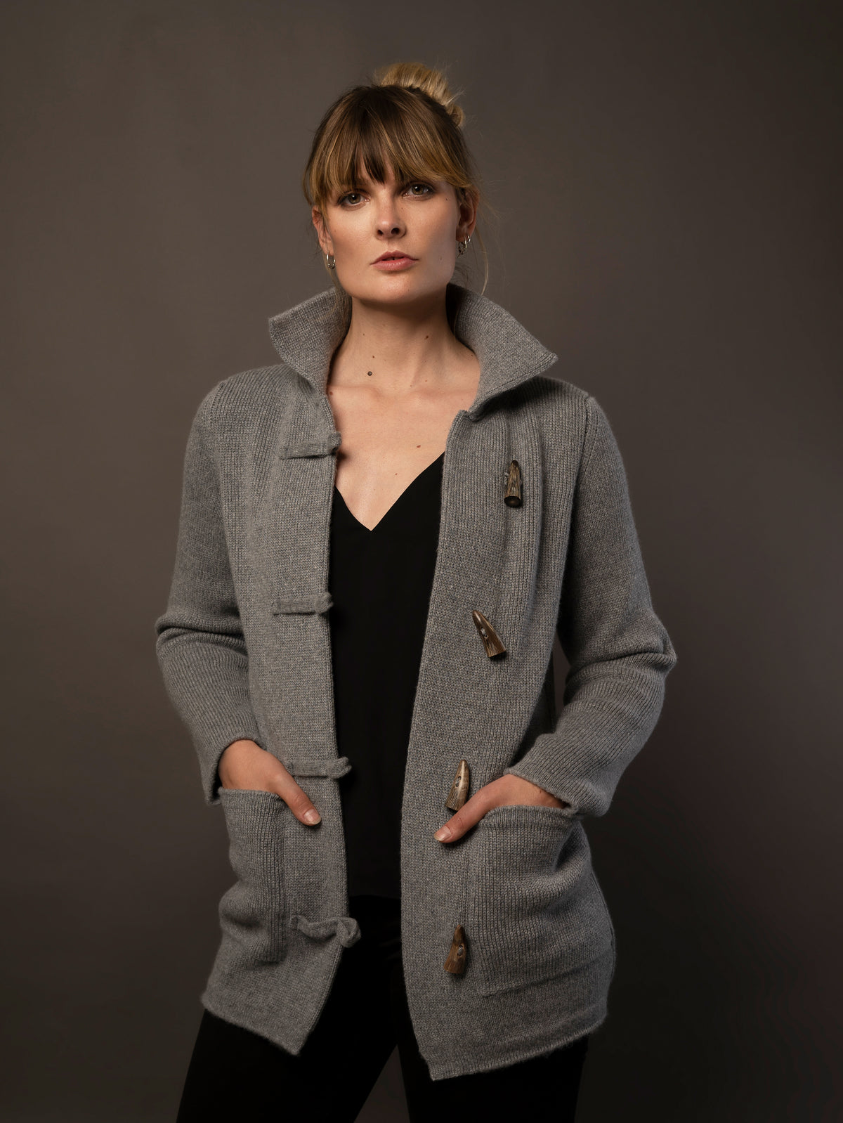 Ladies Cashmere Duffle Coat in Dark Grey. 100% cashmere handmade under the Royal Warrant in the UK. This is Cashmere at it&#39;s finest. 